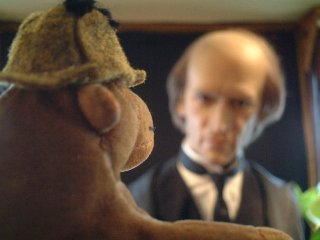 Mr Monkey glaring at a waxwork of Moriarty