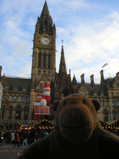 Mr Monkey looking across St Peter's square at the Town Hall