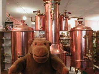 Mr Monkey with a set of copper tea urns