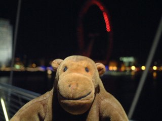 Mr Monkey crossing a bridge in the dark