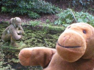 Mr Monkey with a statue