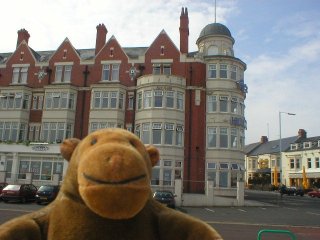 Mr Monkey in front of the Rex Hotel