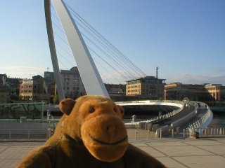 Mr Monkey in front of the Gateshead Millennium Bridge