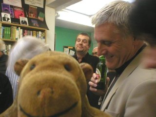 Mr Monkey at a book launch - that's Mark Billingham in the middle