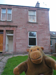 Mr Monkey outside Miss Helen's new house