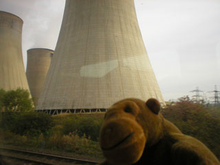 Mr Monkey passing a cooling tower