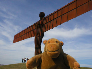 Mr Monkey in front of the Angel of the North