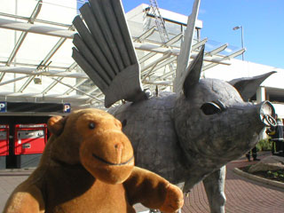 Mr Monkey with a large metal pig with wings