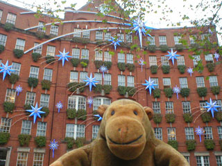 Mr Monkey outside an office block on Store Street