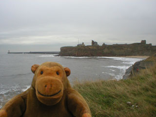 Mr Monkey with the castle and priory headland in the distance