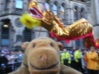 The golden dragon dancing behind Mr Monkey