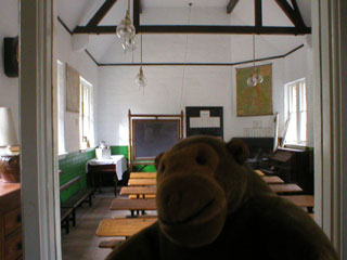 Mr Monkey looking into a classroom