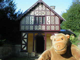 Mr Monkey outside the Cheshire Cottage