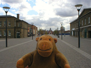 Mr Monkey looking down the main street through the Royal Arsenal