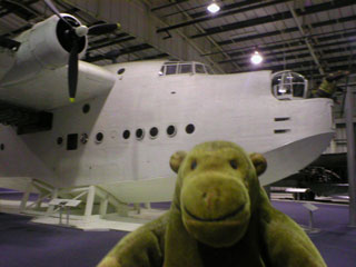 Mr Monkey in front of a Short Sunderland flying boat