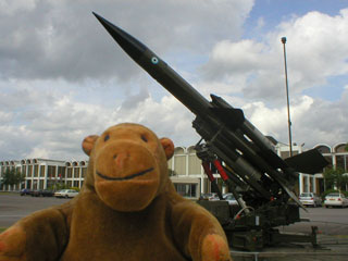 Mr Monkey in front of a ground to air missile