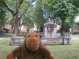 Mr Monkey sitting on the railings around Sir John Soanes tomb