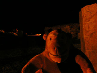 Mr Monkey in the castle's stone circle at night