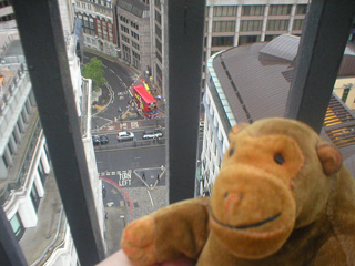 Mr Monkey looking down to the street