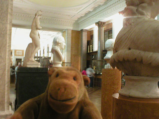 Mr Monkey examining carvings in the King's Library