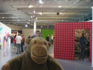 Mr Monkey watching someone look inside the big head
