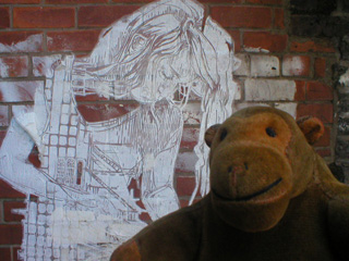 Mr Monkey examining a Swoon paper cut-out