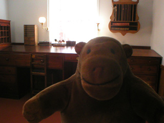 Mr Monkey looking at the mill clerks desk