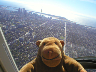 Mr Monkey looking along Bathurst Street towards the CN Tower