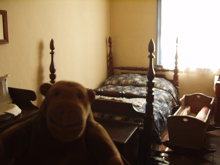 Mr Monkey in a bedroom in the Yellow House