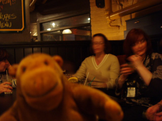 Mr Monkey in a bar full of people