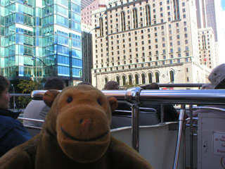 Mr Monkey approaching the Fairmont Royal York by bus