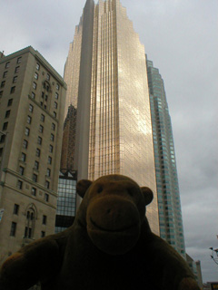 Mr Monkey in front of the Royal Plaza bank