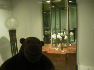 Mr Monkey examining Art Deco furniture