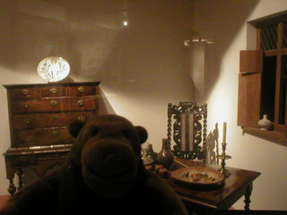 Mr Monkey looking at a reconstructed English medieval room