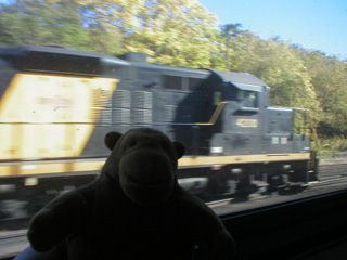 Mr Monkey looking at a diesel engine on another track