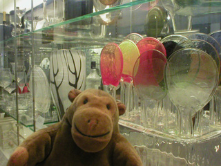 Mr Monkey looking a case of modern glasswork