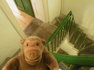 Mr Monkey climbing the stairs inside the Wellington Arch