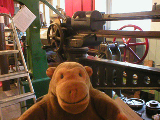 Mr Monkey near the control wheel of the Kirkaldy testing machine