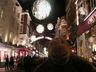 Mr Monkey looking Christmas lights on Carnaby Street