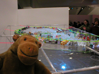 Mr Monkey looking at a model of an imaginary Barnsley