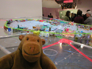 Mr Monkey looking at a model of an imaginary Barnsley