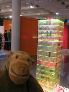 Mr Monkey looking Farm, a green perspex tower