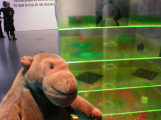 Mr Monkey examining the green perspex Farm tower close up