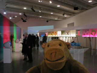 Mr Monkey looking at Pier, a long set of boxes on legs