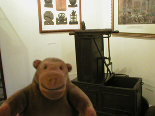 Mr Monkey with a 17th century hand pump