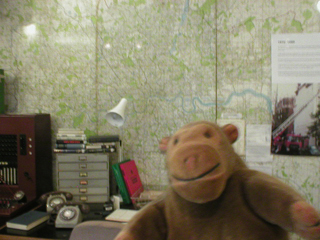 Mr Monkey with a mock-up of a control desk
