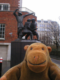 Mr Monkey in front of the firefighter's monument