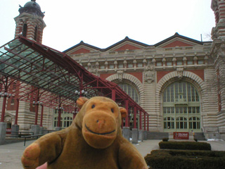 Mr Monkey in front of the main building of Ellis Island