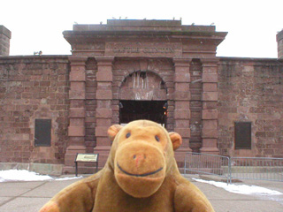 Mr Monkey outside the gates of Castle Clinton