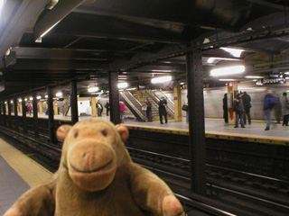 Mr Monkey waiting on a subway platform